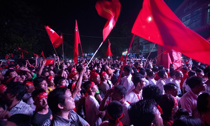 Supporters of Aung San Suu Kyi’s National League for Democracy party cheer as they watch the results of the Myanmar general election on an LED screen in Yangon. (photo credit: Khin Maung Win/AP) Supporters of Aung San Suu Kyi’s National League for Democracy party cheer as they watch the results of the Myanmar general election on an LED screen in Yangon. (photo credit: Khin Maung Win/AP)