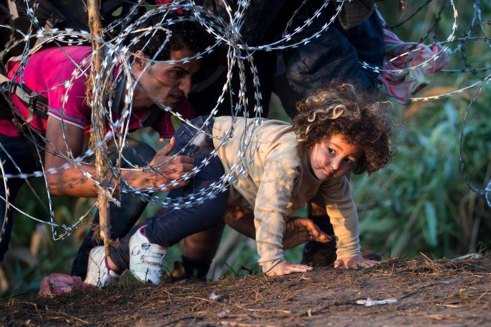 Child crossing from Serbia to Hungary (photo credit: AP Photo/Darko Bandic) Child crossing from Serbia to Hungary (photo credit: AP Photo/Darko Bandic)