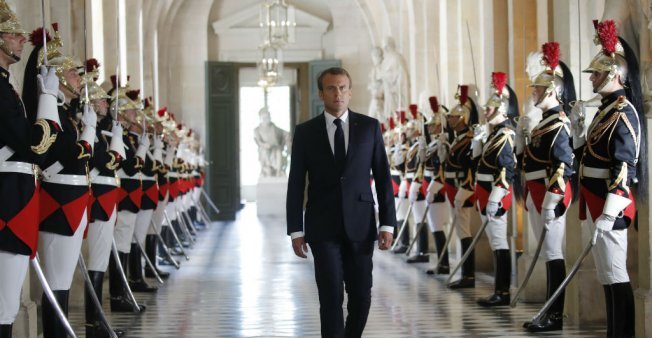 Emmanuel Macron walks towards the Hemicycle to address Parliament in a Congress at Versailles on July 9 (photo credit: Charles Platiau/AFP)