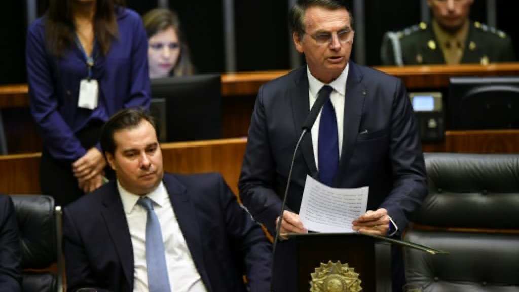Jair Bolsonaro (R), next to President of Lower House of Congress Rodrigo Maia - addresses Congress (photo credit: AFP) Jair Bolsonaro (R), next to President of Lower House of Congress Rodrigo Maia - addresses Congress (photo credit: AFP)