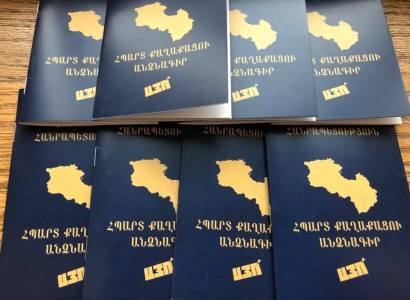 Prime Minister of Armenia unveils booklet which reads 'Passport of  a Proud Citizen - YES' (photo credit: Office of the Prime Minister)