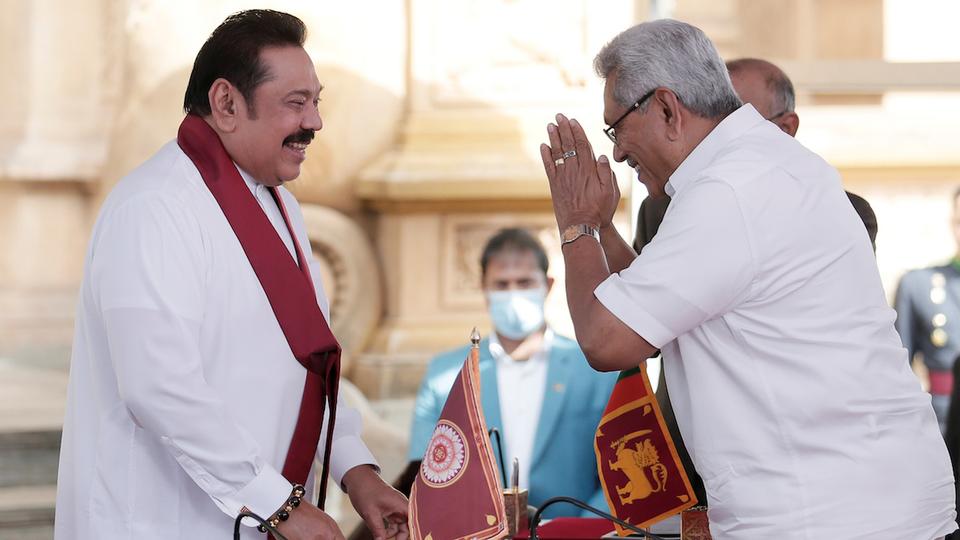 President Gotbaya Rajapaksa - right - swears in his brother and former President Mahinda Rajapaksa as Prime Minister (photo credit: Reuters)