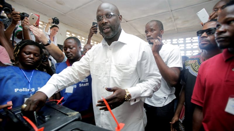 President Weah casts his vote ruing the runoff presidential election (photo credit: Thierry Gougnon/Reuters)