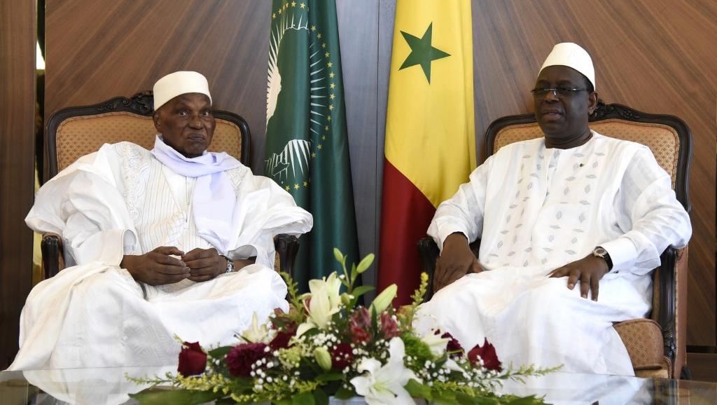 Former President Abdoulaye  Wade (left) and President Macky Sall meeting in Oct 2019 (photo credit: Seyllou/AFP)