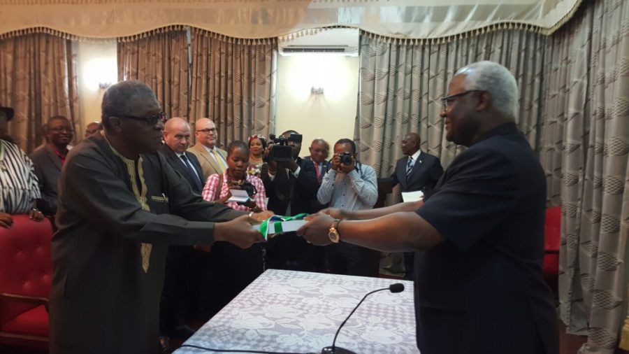 President Koroma receiving the report (photo credit: The Sierra Leone Telegraph)