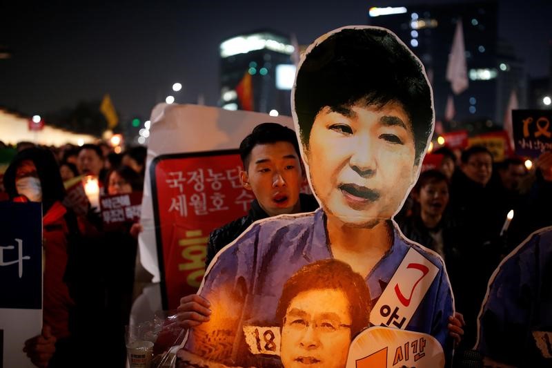 Protesters demanding the resignation of South Korean President Park Geun-hye (photo credit: Reuters) Protesters demanding the resignation of South Korean President Park Geun-hye (photo credit: Reuters)