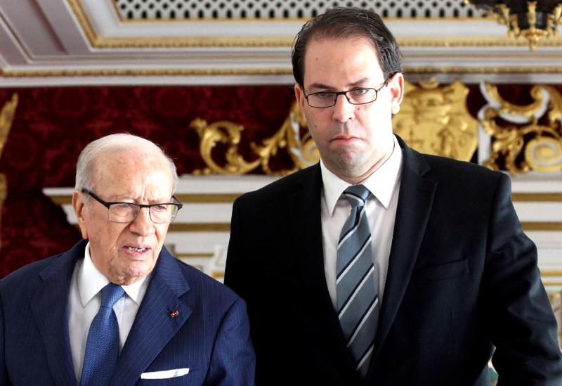 Tunisian Prime Minister Youssef Chahed (R) and Tunisian President Beji Caid Essebsi (photo credit: AFP)