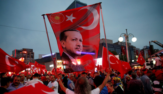 Supporters hold a flag depicting Turkish President Recep Tayyip Erdogan (photo credit: REUTERS/Baz Ratner) Supporters hold a flag depicting Turkish President Recep Tayyip Erdogan (photo credit: REUTERS/Baz Ratner)