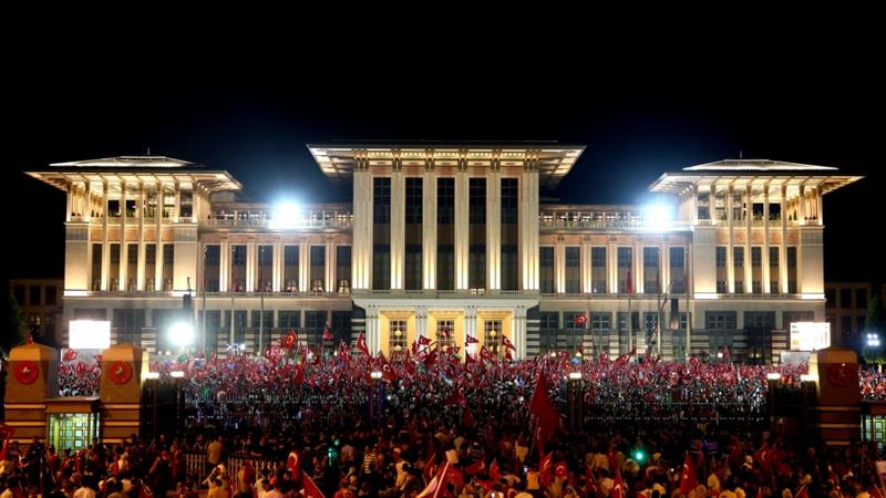 Supporters of the ruling party gather at the presidential palace (photo credit: AP)