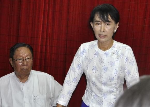 Myanmar pro-democracy leader Aung San Suu Kyi with Spokesman of the National League for Democracy (NLD), Nyan Win (photo credit: Reuters)