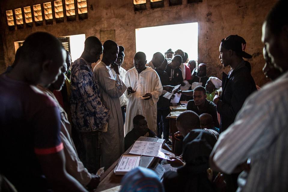 Voters collect their cards at the polling station at the Koudoukou school in the PK5 district in Bangui on Monday. (photo credit: AFP) Voters collect their cards at the polling station at the Koudoukou school in the PK5 district in Bangui on Monday. (photo credit: AFP)