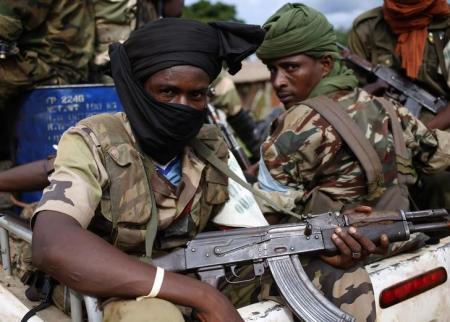 Seleka fighters sit in a vehicle in a village between Bambari and Grimari May 31, 2014. Picture taken May 31, 2014. (photo credit: Reuters)