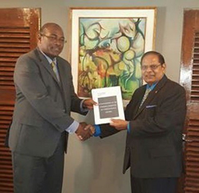 Head of the steering committee on constitutional reform, Nigel Hughes (left) delivering the report to Prime Minister Moses Nagamootoo (photo credit: Demerara waves) Head of the steering committee on constitutional reform, Nigel Hughes (left) delivering the report to Prime Minister Moses Nagamootoo (photo credit: Demerara waves)