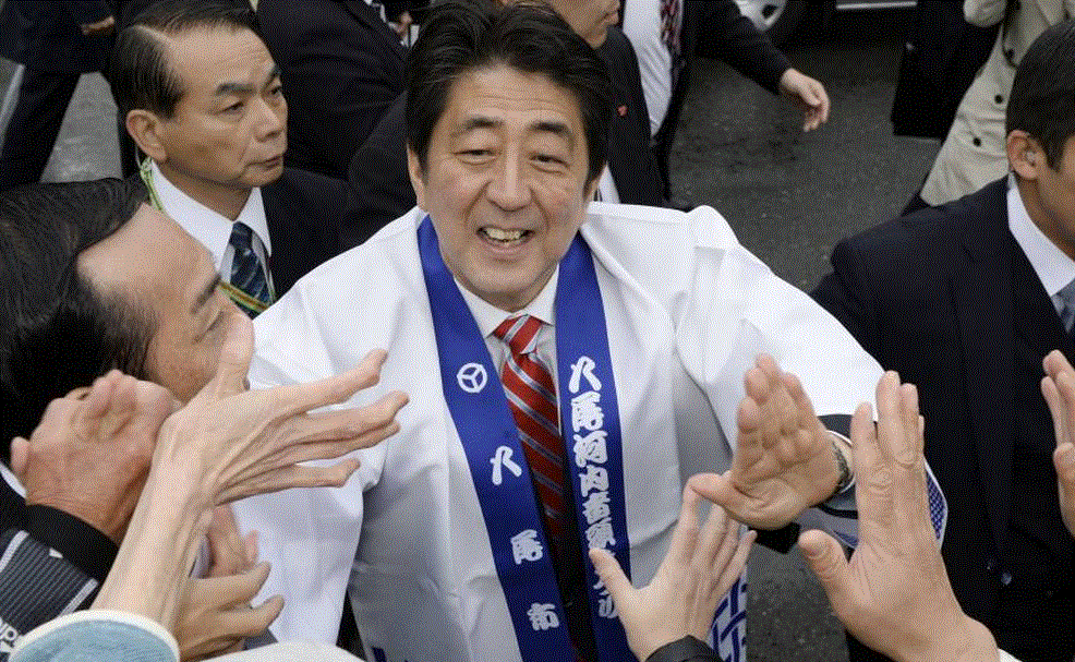 Prime Minister Shinzo Abe campaigns for votes in Yao, Osaka Prefecture, last Thursday. | KYODO Prime Minister Shinzo Abe campaigns for votes. KYODO