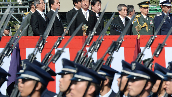 Japanese Prime Minister Shinzo Abe (top C) inspects troops of Japan's Self-Defence Force (Photo credit: AFP/Toru Yamanaka) Japanese Prime Minister Shinzo Abe (top C) inspects troops of Japan's Self-Defence Force (Photo credit: AFP/Toru Yamanaka)