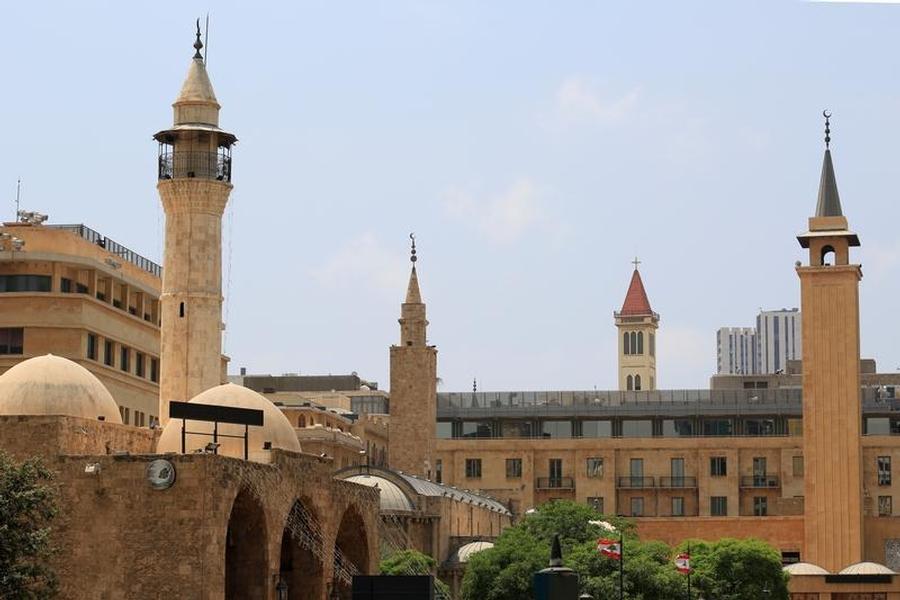 Lebanese flags flutter near minarets and bell towers in downtown Beirut, Lebanon (photo credit: REUTERS/Jamal Saidi)