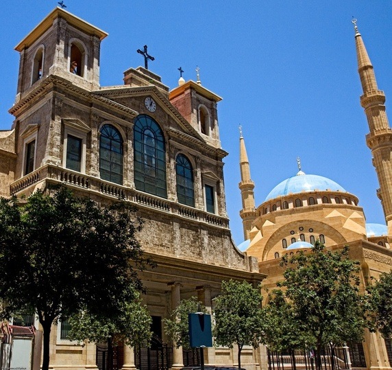 A church and a mosque stand next to each other (Photo credit: Quora) 