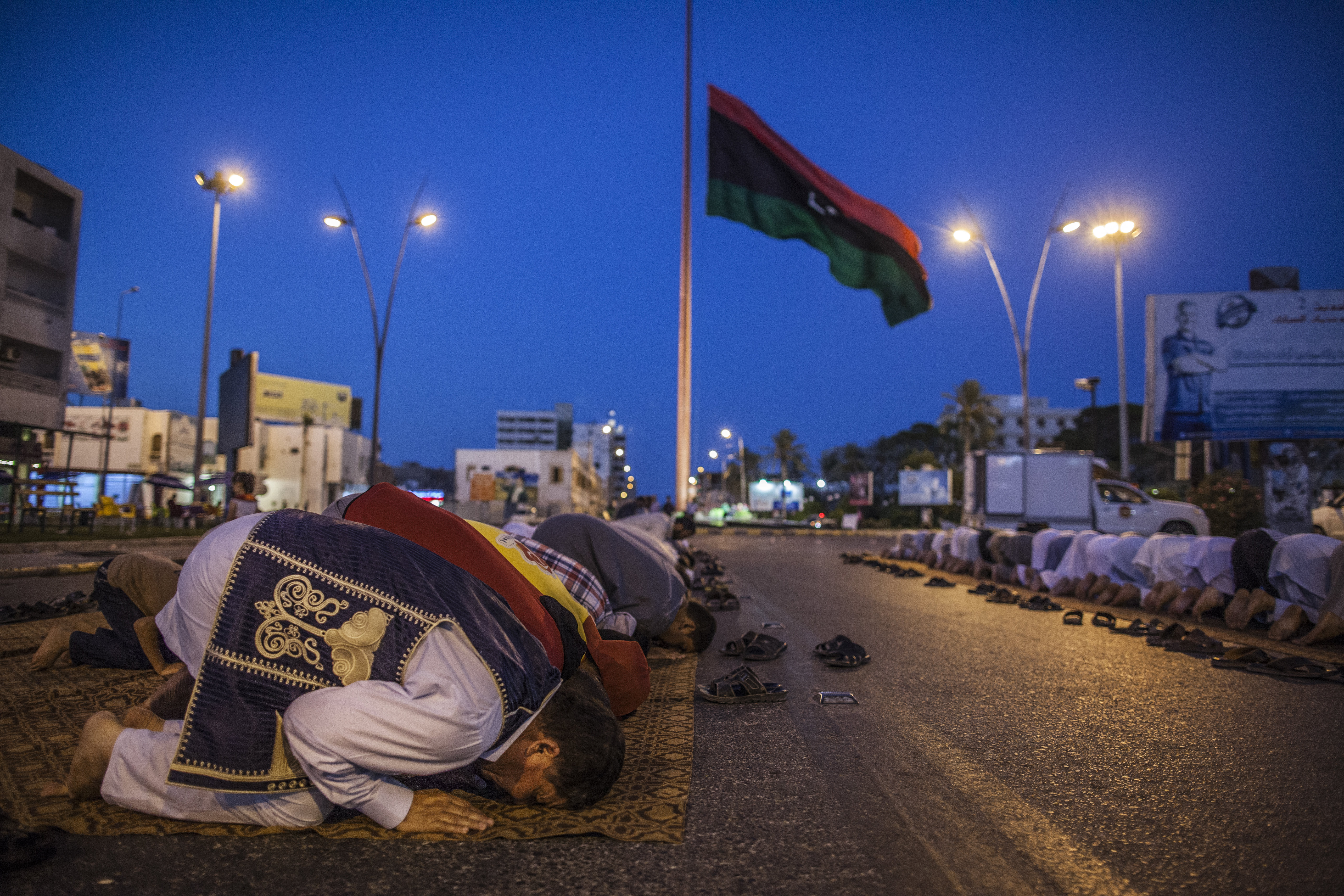 Dozens of residents in Misurata pray after attending a protest organized to voice their discontent with what they perceive is Gen. Khalifa Hifter's alliance with Egypt's government [photo credit: Javier Manzano/For The Washington Post]