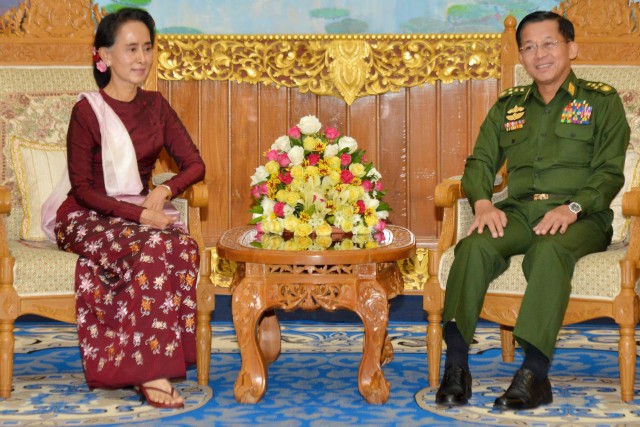 Aung San Suu Kyi, chairperson NLD, with military commander-in-chief Senior General Min Aung Hlaing (photo credit: AFP)