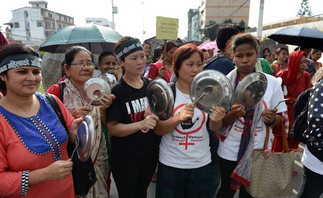 Nepalese activists bang plates and spoons as they take part in a protest demanding equal citizenship rights in the new constitution in Kathmandu on August 10, 2015 [photo credit: AFP]