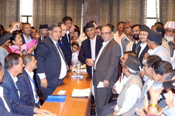Dahal shakes hands with Deuba after filing his candidacy for the post of Prime Minister on Tuesday (photo credit: RSS)