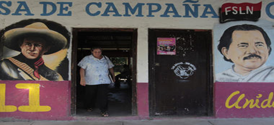 A woman walks past murals of Nicaragua's President Daniel Ortega (r.) and Nicaraguan revolutionary and Sandinista leader Augusto Cesar Sandino in Catarina November 4. President Ortega's ruling Sandinista National Liberation Front party will seek to change the constitution by year-end to remove presidential term limits. A woman walks past murals of Nicaragua's President Daniel Ortega (r.) and Nicaraguan revolutionary and Sandinista leader Augusto Cesar Sandino in Catarina November 4. President Ortega's ruling Sandinista National Liberation Front party will seek to change the constitution by year-end to remove presidential term limits.