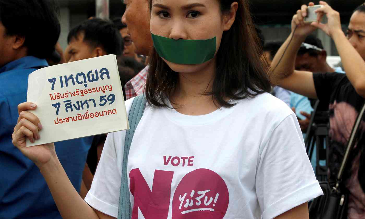 Activists protest against the junta-backed constitution draft